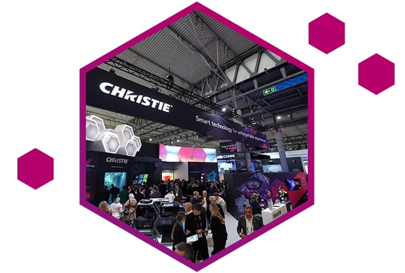 An image of a large crowd of people attending a trade show