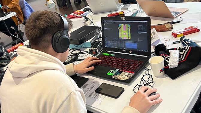 Student learning about projection mapping with hands-on training